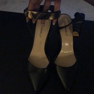 Ankle strap heels with gold detail on strap.